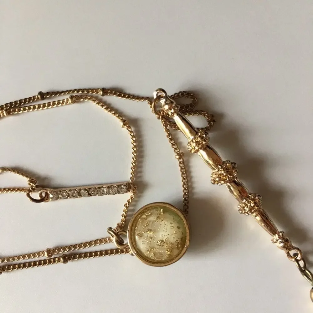 Boho gold tone three strand layered necklace